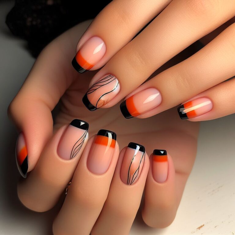 Chic Noir: French Manicure with Black and Orange Accents