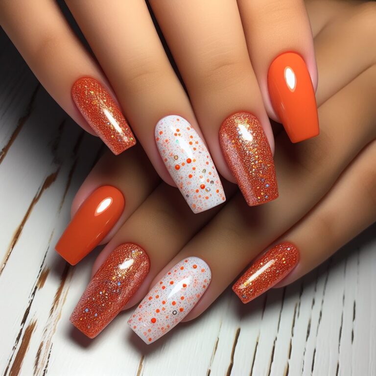 Citrus Chic: Orange and White Nails Infused with Glitter Glamour