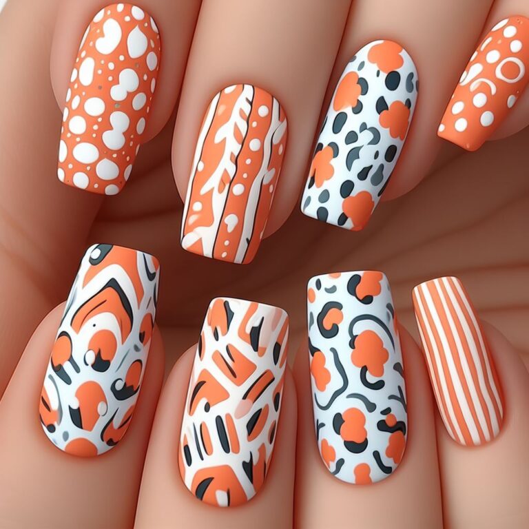 Safari Sunset Chic: Orange and White Nails with Trendy Animal Print Accents